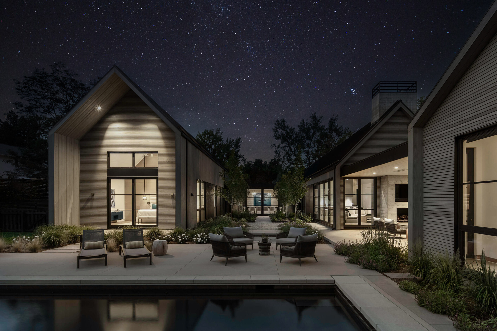 A residential landscape design by Green Landscape Solutions in Boulder at night.